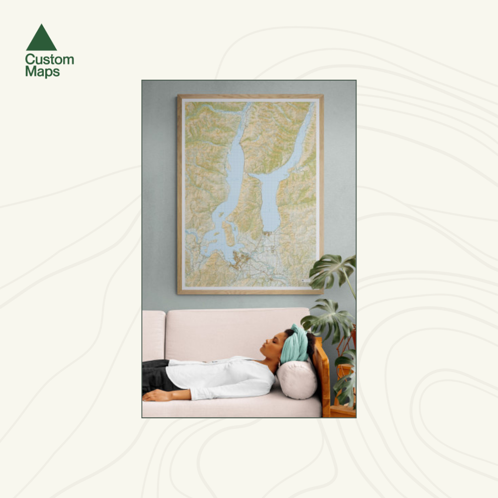Person lying on a couch with a map of Wanaka and Hawea