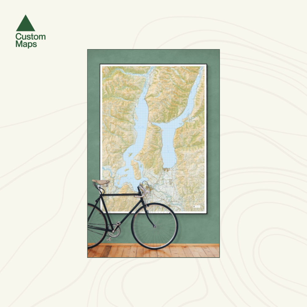Framed topographic map of Wanaka and Hawea with a bicycle