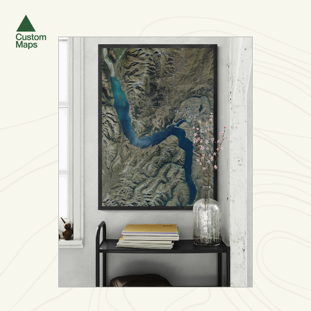 Framed aerial map of Queenstown in a modern interior setting.