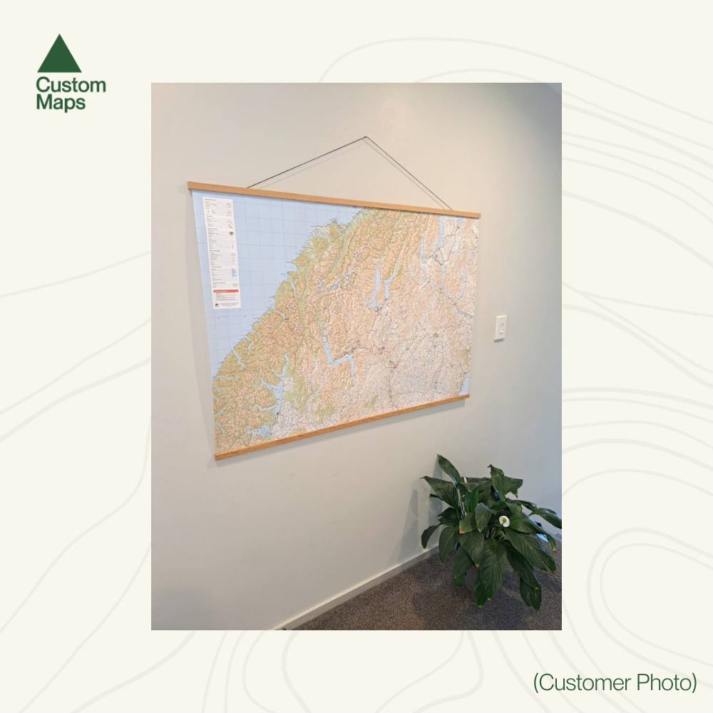 Map hanging on a wall in an indoor setting with 'Custom Maps' branding.