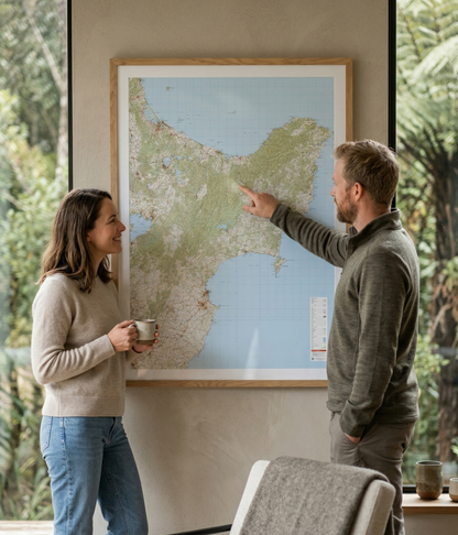 Two people looking at a map of the Eastern North Island together
