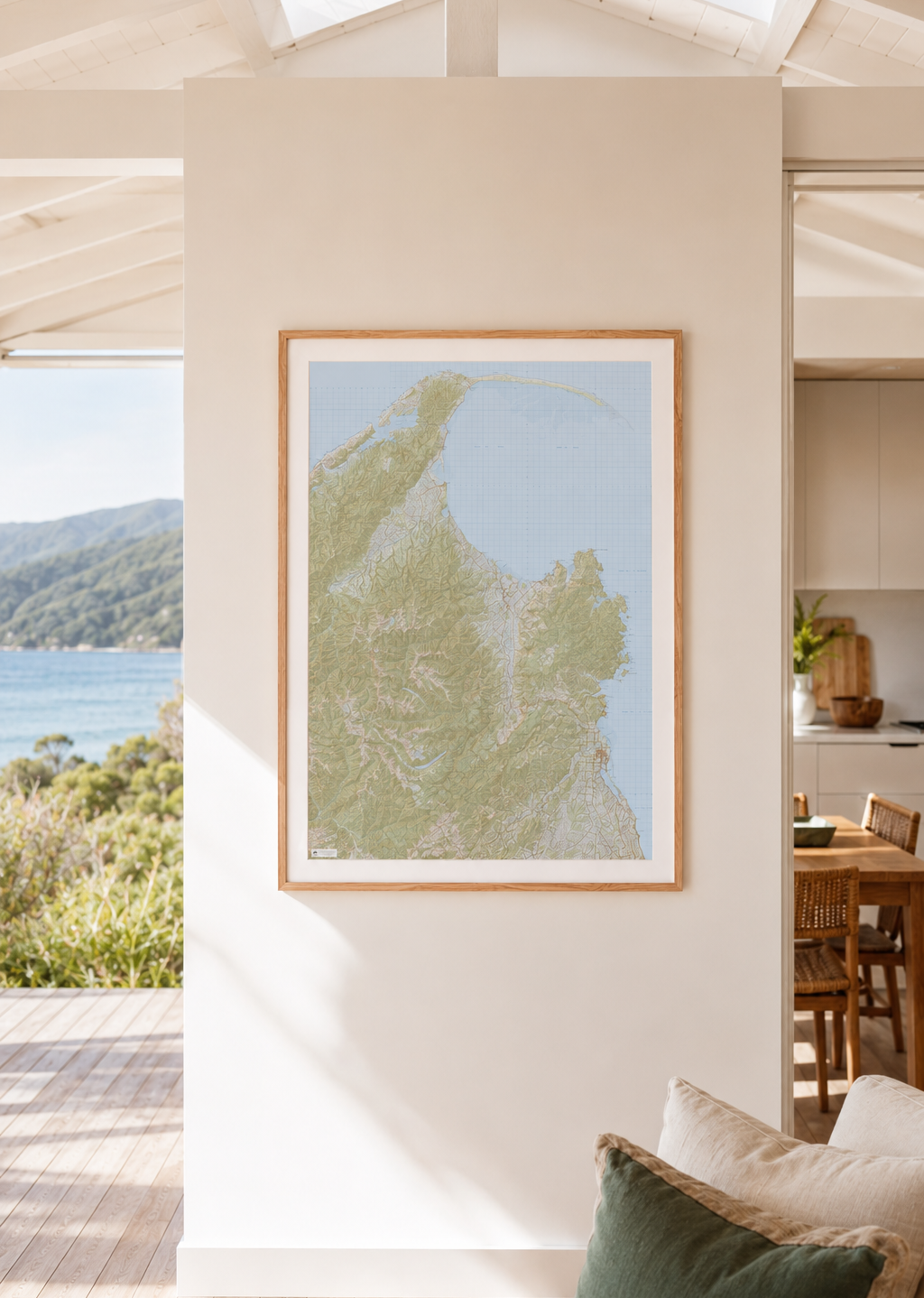 Framed artwork on a wall with a view of Golden Bay