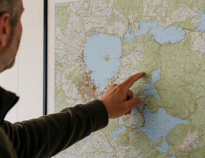 Person pointing at a map of Rotorua