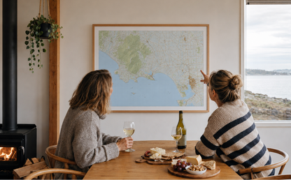 Two women looking at a framed map of Riverton and the surrounding area