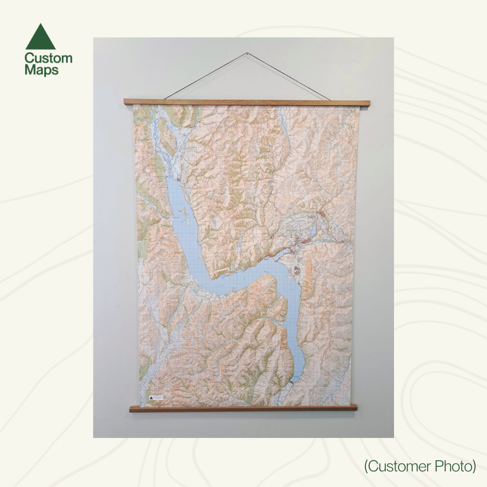 Topographic map on a wooden frame against a white background with 'Custom Maps' branding.