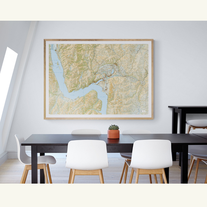 Framed map of Queenstown and Arrowtown on a wall above a dining table with chairs